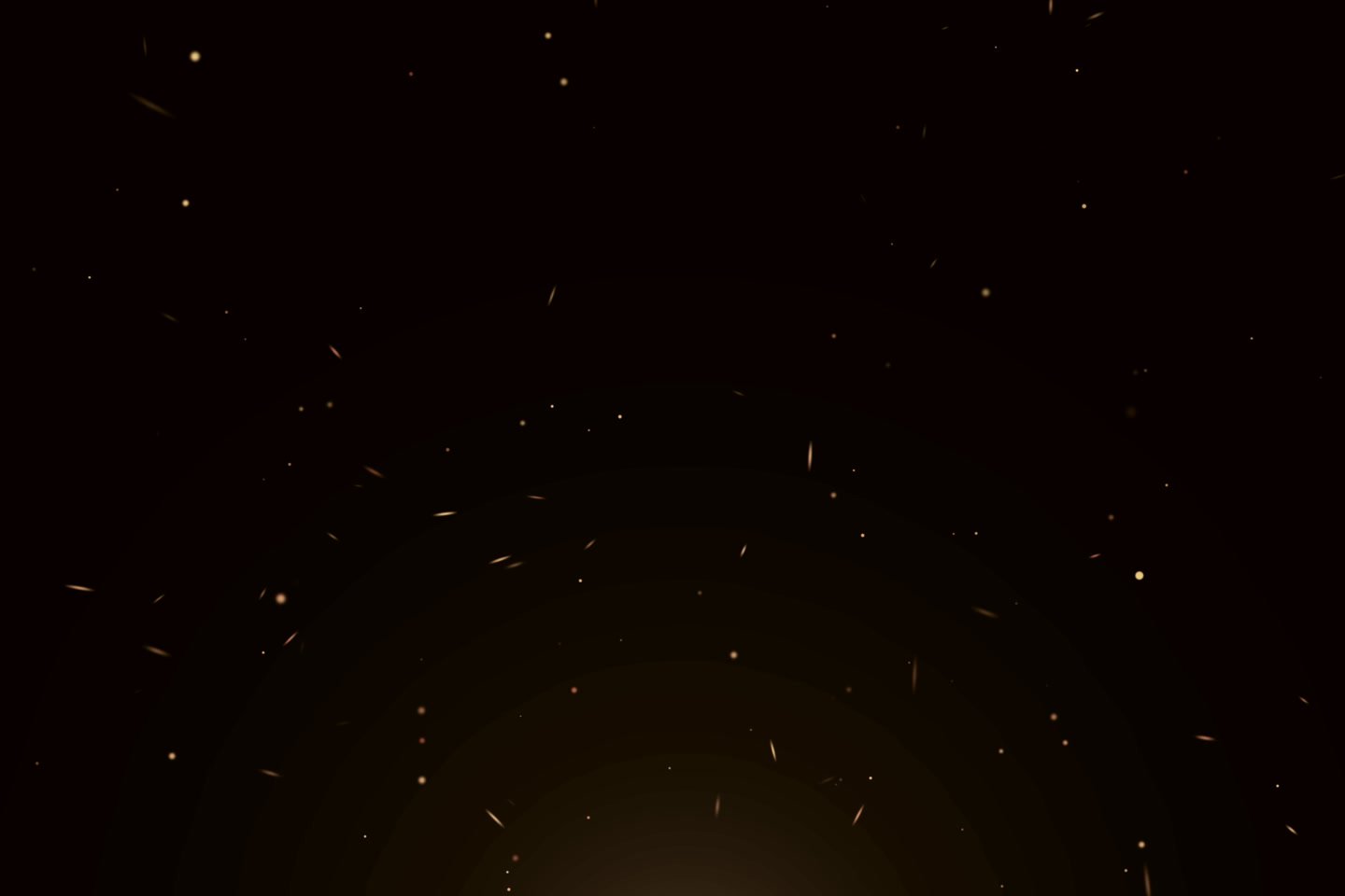 Embers rising against black.